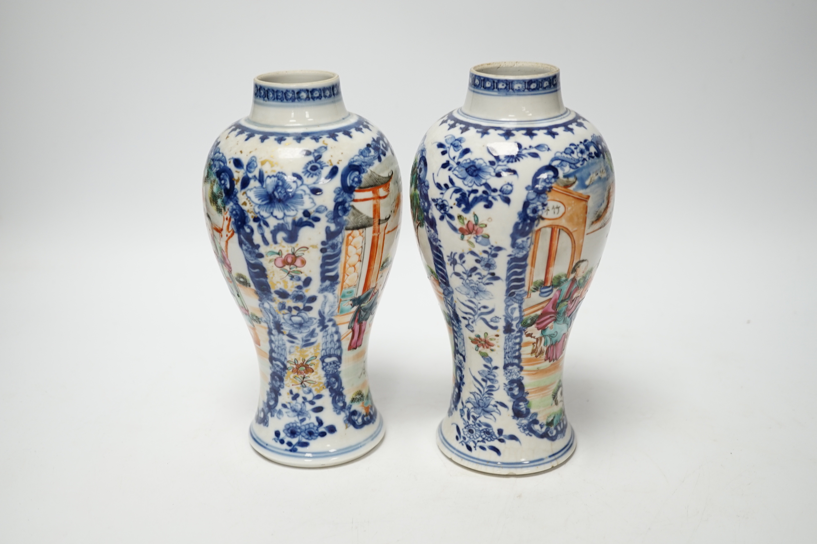 A pair of late 18th century Chinese famille rose ‘mandarin’ vases, 19cm high